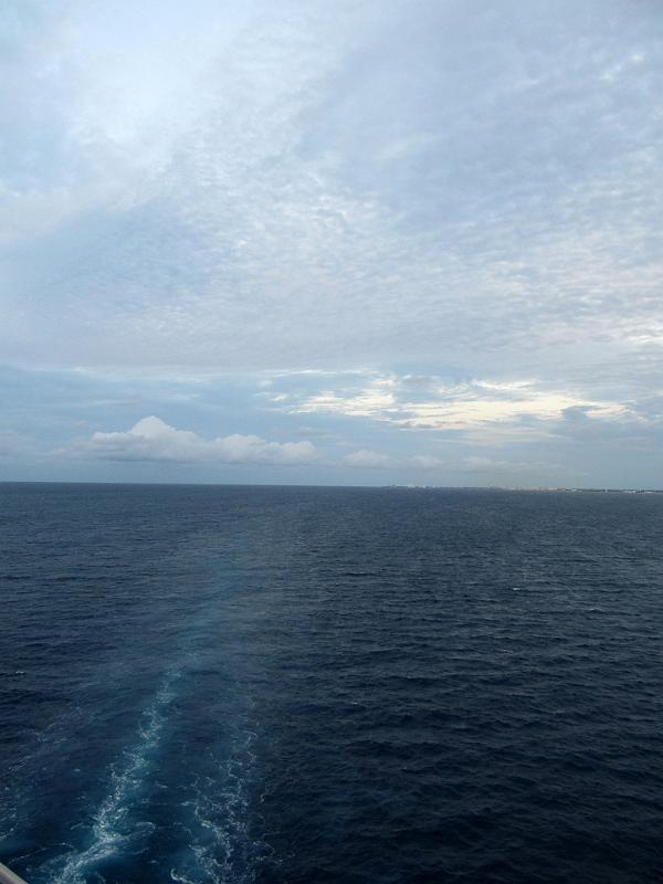 IMG_0741.JPG - Carnival Glory's wake and view of Cozumel in distance